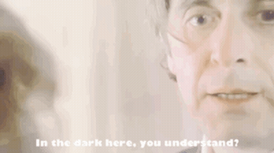 A Close Up Of A Man 'S Face With The Words In The Dark Here You Understand Below It GIF