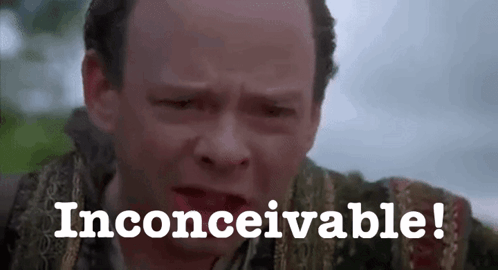 A Close Up Of A Man 'S Face With The Words Inconceivable Written On It . GIF