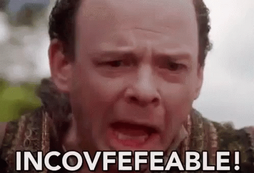 A Close Up Of A Man 'S Face With The Words Incovfefeable Written On It . GIF