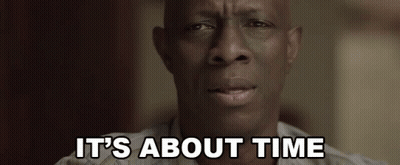 A Close Up Of A Man 'S Face With The Words `` It 'S About Time '' Written Above Him . GIF