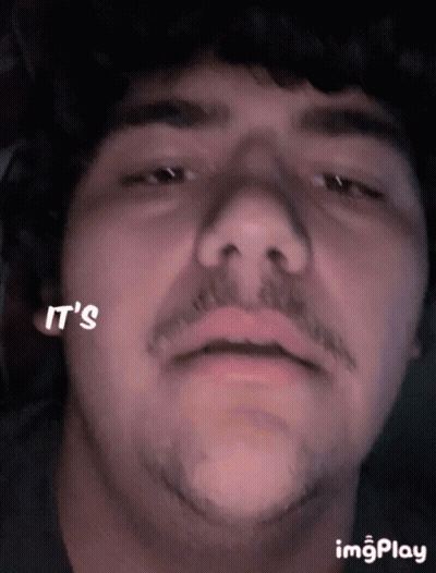 A Close Up Of A Man 'S Face With The Words It 'S Written On His Cheek GIF