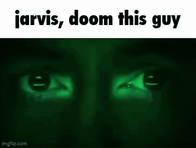 A Close Up Of A Man 'S Face With The Words Jarvis , Doom This Guy Written On The Bottom . GIF