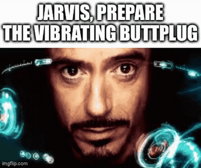 A Close Up Of A Man 'S Face With The Words `` Jarvis Prepare The Vibrating Buttplug '' Written On It . GIF