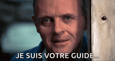 A Close Up Of A Man 'S Face With The Words Je Suis Votre Guide Written On The Bottom GIF