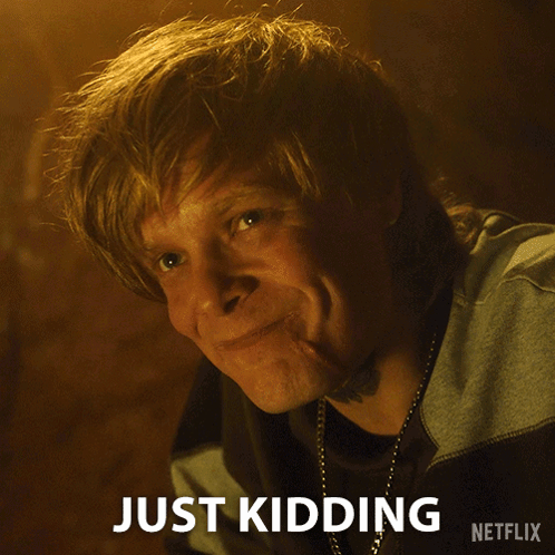 A Close Up Of A Man 'S Face With The Words Just Kidding Written On The Bottom GIF