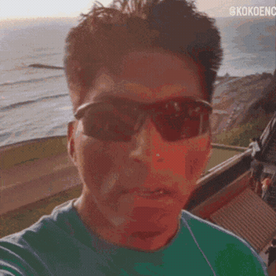 A Close Up Of A Man 'S Face With The Words @Kokoenc On The Bottom GIF