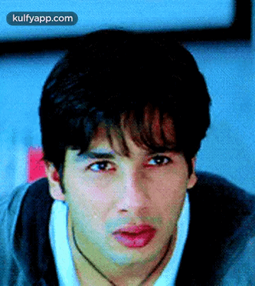 A Close Up Of A Man 'S Face With The Words Kulfyapp.com At The Top GIF