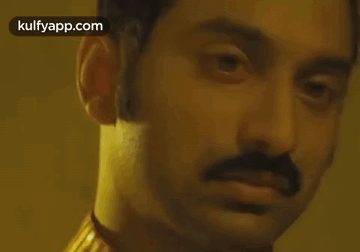 A Close Up Of A Man 'S Face With The Words Kulfyapp.com Visible GIF