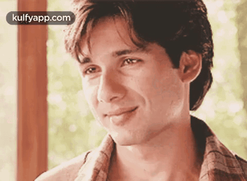 A Close Up Of A Man 'S Face With The Words Kulfyapp.com Written On The Bottom GIF
