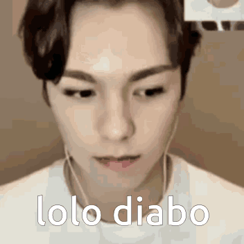 A Close Up Of A Man 'S Face With The Words Lolo Diabo Written On It . GIF