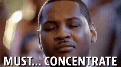 A Close Up Of A Man 'S Face With The Words Must Concentrate Above Him . GIF
