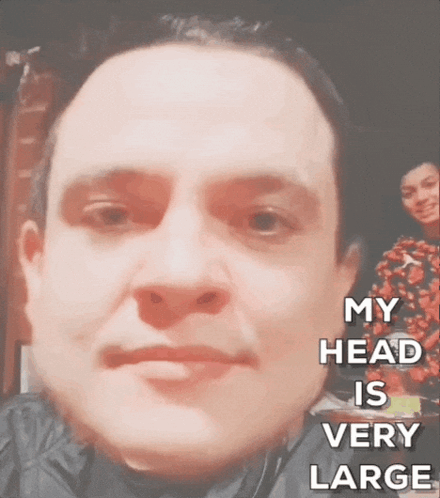 A Close Up Of A Man 'S Face With The Words My Head Is Very Large Below It GIF