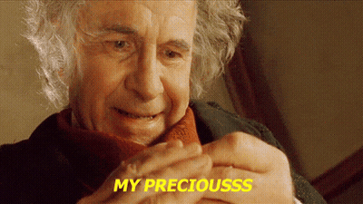A Close Up Of A Man 'S Face With The Words `` My Preciousss '' Written On The Bottom . GIF