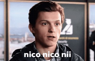 A Close Up Of A Man 'S Face With The Words `` Nico Nico Niu '' On It . GIF
