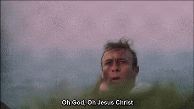 A Close Up Of A Man 'S Face With The Words `` Oh God , Oh Jesus Christ '' Written Above Him . GIF