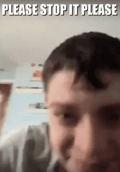 A Close Up Of A Man 'S Face With The Words Please Stop It Please Written Above It GIF