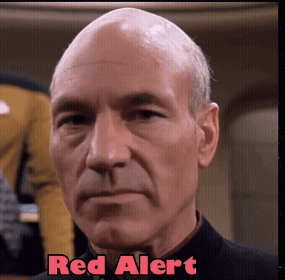 A Close Up Of A Man 'S Face With The Words Red Alert Written Above Him GIF