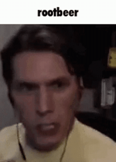 A Close Up Of A Man 'S Face With The Words `` Rootbeer '' Written Above Him . GIF