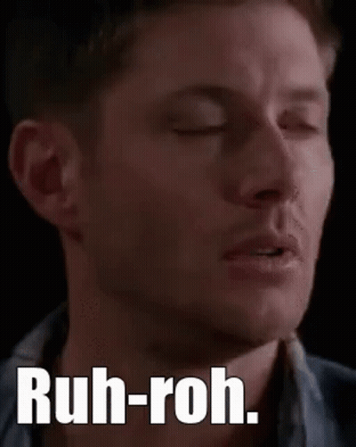 A Close Up Of A Man 'S Face With The Words `` Ruh-Roh '' On It . GIF