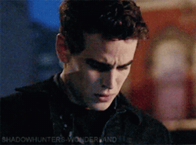 A Close Up Of A Man 'S Face With The Words Shadowhunters Wonderland In The Corner GIF