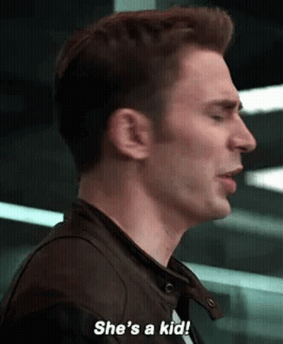 A Close Up Of A Man 'S Face With The Words `` She 'S A Kid '' . GIF