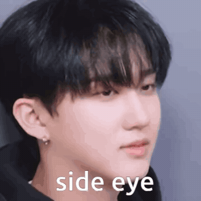 A Close Up Of A Man 'S Face With The Words `` Side Eye '' Written On It . GIF