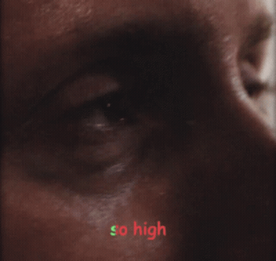 A Close Up Of A Man 'S Face With The Words So High Written In Green GIF