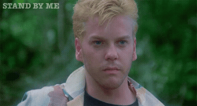 A Close Up Of A Man 'S Face With The Words " Stand By Me " Above Him GIF