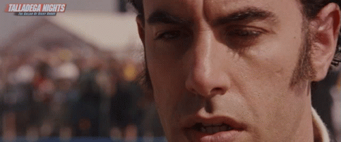 A Close Up Of A Man 'S Face With The Words Talladega Nights On The Bottom Right GIF