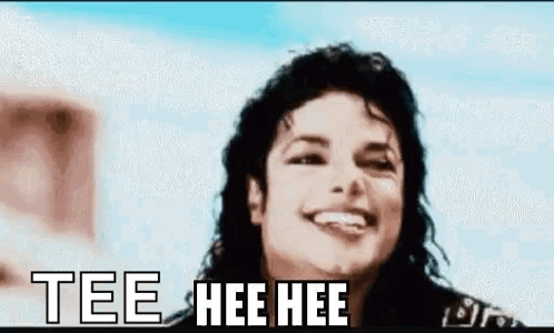 A Close Up Of A Man 'S Face With The Words Tee Hee Hee Written On It . GIF