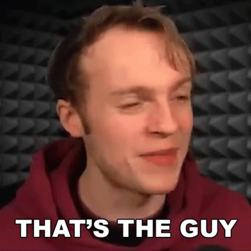 A Close Up Of A Man 'S Face With The Words That 'S The Guy Below Him GIF