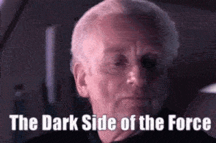 A Close Up Of A Man 'S Face With The Words `` The Dark Side Of The Force '' Written Below Him . GIF