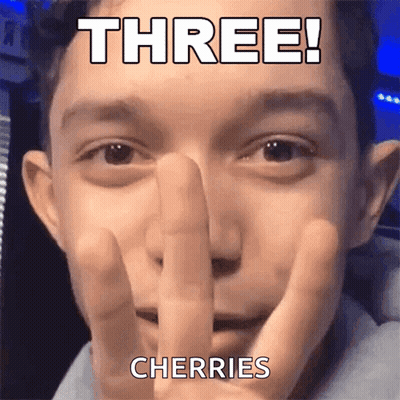 A Close Up Of A Man 'S Face With The Words Three Cherries Written On It GIF