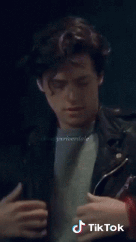 A Close Up Of A Man 'S Face With The Words Tik Tok On The Bottom Left GIF