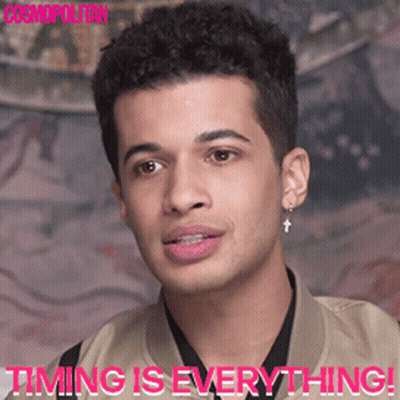 A Close Up Of A Man 'S Face With The Words " Timing Is Everything " Below Him GIF