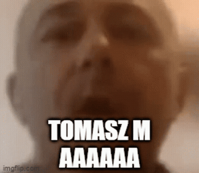 A Close Up Of A Man 'S Face With The Words Tomasz M Aaaaa GIF