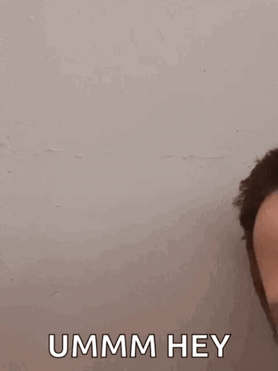A Close Up Of A Man 'S Face With The Words `` Ummm Hey '' Written On The Bottom . GIF