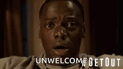 A Close Up Of A Man 'S Face With The Words Unwelcome Getout Above Him GIF