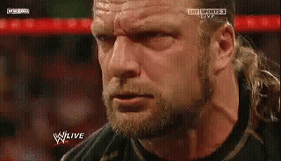 A Close Up Of A Man 'S Face With The Words W Live On The Bottom Right GIF