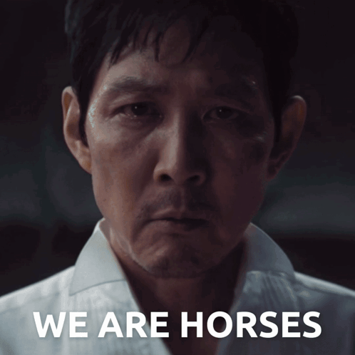 A Close Up Of A Man 'S Face With The Words We Are Horses Below Him GIF