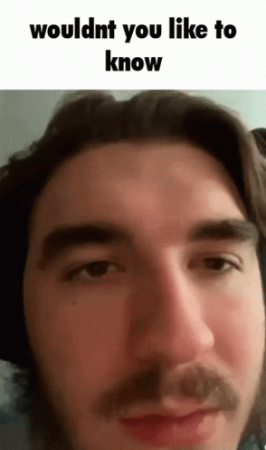 A Close Up Of A Man 'S Face With The Words Wouldnt You Like To Know Above It GIF