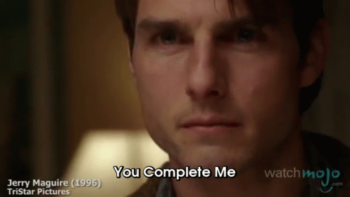 A Close Up Of A Man 'S Face With The Words `` You Complete Me '' On The Bottom . GIF