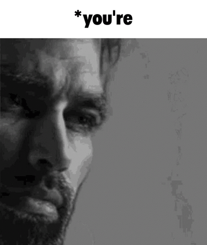 A Close Up Of A Man 'S Face With The Words `` You 'Re '' Above Him . GIF