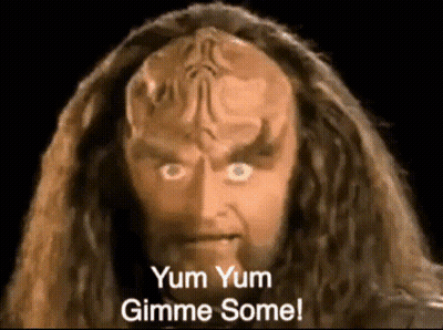 A Close Up Of A Man 'S Face With The Words Yum Yum Gimme Some GIF