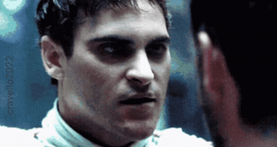 A Close Up Of A Man 'S Face With The Year 2022 Visible GIF