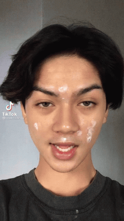 A Close Up Of A Man 'S Face With Tiktok Written On The Bottom Left GIF