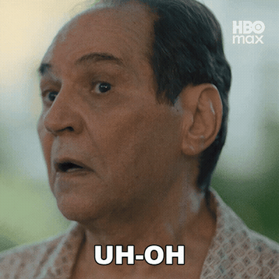 A Close Up Of A Man 'S Face With Uh-Oh Written On His Face GIF