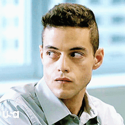 A Close Up Of A Man 'S Face With Usa Written On The Sleeve Of His Shirt GIF