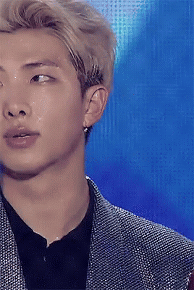 A Close Up Of A Man 'S Face With Water Coming Out Of His Eyes GIF