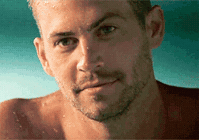 A Close Up Of A Man 'S Face With Water Drops On It GIF